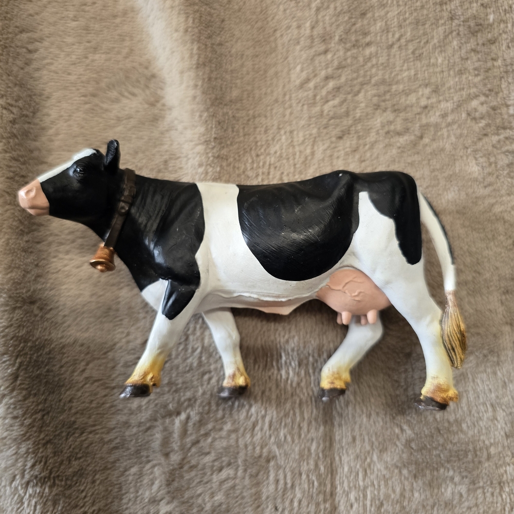 Safari Ltd Holstein Cow figurine, part of the Safari Farm collection.